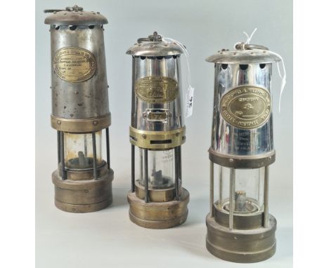 Three vintage Miners' lamps, all marked E Thomas &amp; Williams Aberdare, one marked No. B/136, another No. 49868. (3)  (B.P.