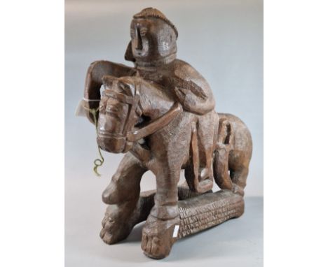 Unusual naïve carved hardwood study of Prince Llewelyn on horseback, having carved Welsh text to each side panel front and ba