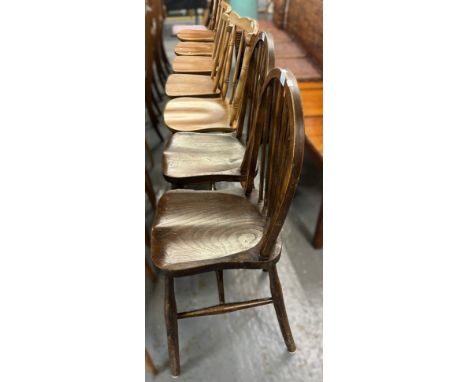 Collection of chairs to include: pair of elm wheel and spindle back kitchen chairs and five similar beech and elm spindle bac