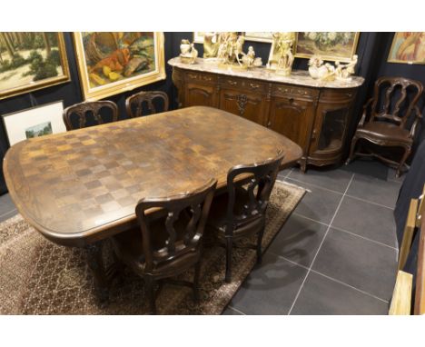 vintage dining-room suite in oak- with sculpted Régence ornamentation : a extendable table, ten chairs and two armchairs &amp