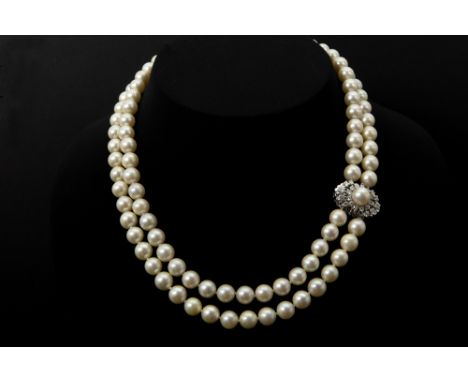 1970's necklace with two rowes of pearls and with a quite big lock in white gold (18 carat) with ca 1 carat of high quality b