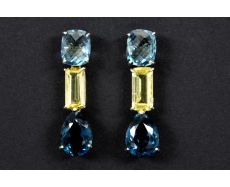 pair of earrings in white gold (18 carat) with ca 3 carat of light yellow Beryl and at least 15 carat of London Topaz with ch
