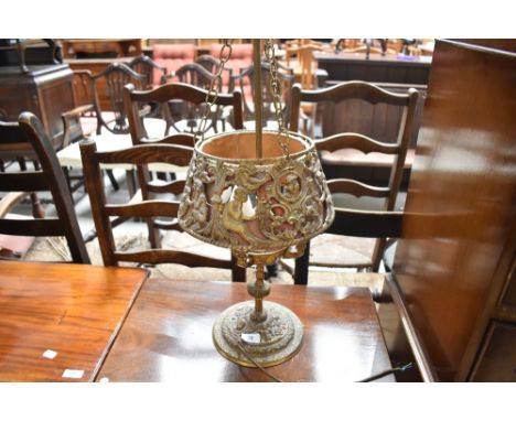 A vintage brass table lamp of ornate design