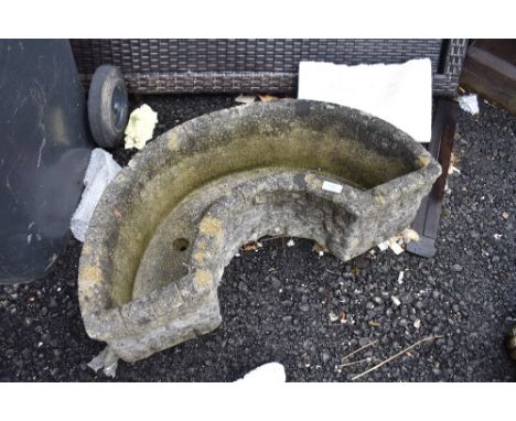 a modern composite concrete half circle trough