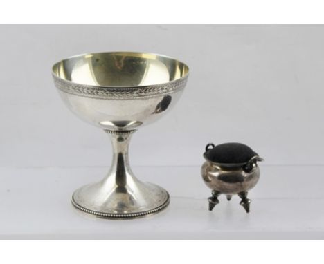 A SILVER CAULDRON DESIGN PIN CUSHION, with swing handle, raised on three turned supports, London 1933 together with a 20th Ce