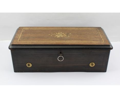 A 19TH CENTURY MUSICAL BOX "P.V.F. ST. CROIX", playing six airs, having simulated rosewood and ebonised case, original song c