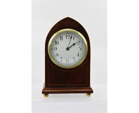 AN EDWARDIAN MAHOGANY CASED LANCET DESIGN MANTEL TIME PIECE the white enamel dial with Arabic numerals, raised on brass ball 