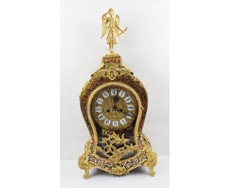 A LOUIS XV STYLE BOULLE WORK MANTEL CLOCK, tortoiseshell and brass marquetry inlaid case with gilt metal mounts, figurative a