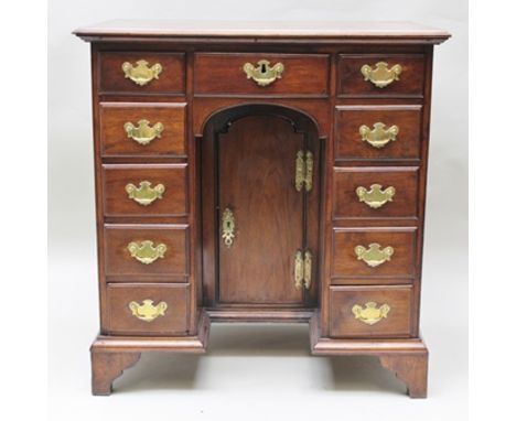 A PART 19TH CENTURY KNEEHOLE DESK, having plain rectangular planked top, over three inline drawers and two columns having fou