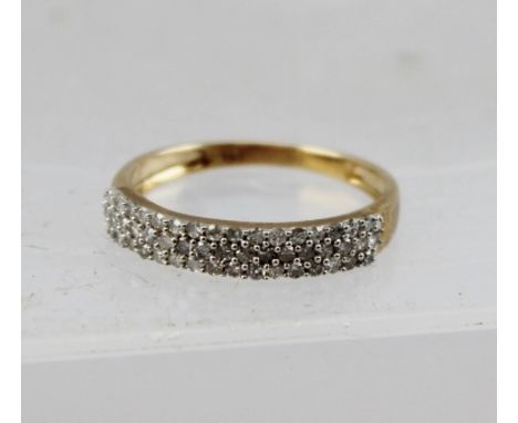 A DIAMOND HALF HOOP ETERNITY RING having three rows of pave set diamonds in white and yellow gold coloured metal setting, sta