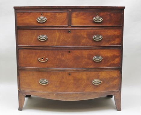 A 19TH CENTURY MAHOGANY BOW FRONTED CHEST of two short over three long drawers with brass handles, on outswept bracket feet, 