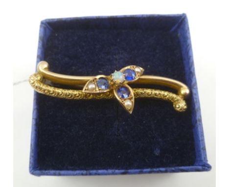 A VICTORIAN 9CT. GOLD BAR BROOCH set with opal and sapphires, bears Chester hallmarks 