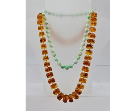 A JADE BEAD NECKLACE, and an AMBER EFFECT NECKLACE 