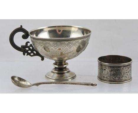 A 19TH CENTURY RUSSIAN SILVER PEDESTAL CUP having scroll handle and engraved belly, later monogrammed tablet, stamped 1884, t