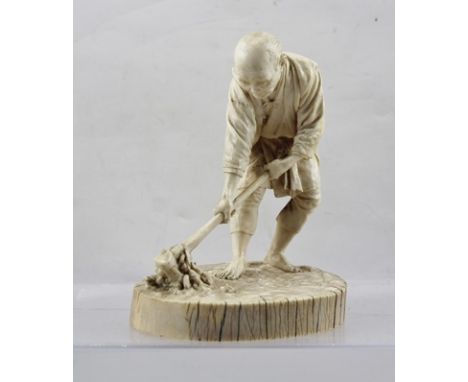 A JAPANESE MEIJI PERIOD IVORY CARVING, depicts an elderly farmer tilling the earth with a hand tool, character marks to base.