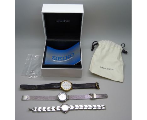 An 18ct gold plated Raymond Weil wristwatch, a lady's Emporio Armani wristwatch, and a lady's Skagen wristwatch