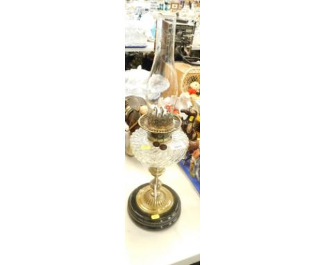 A Victorian brass oil lamp, with glass reservoir, stamped Young's Special Duplex Burner. 