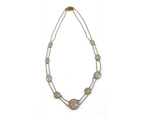 An Opal and yellow metal double strand necklace, made up of nine opals of graduating sizes, the central opal measuring approx