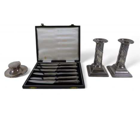 A pair of Victorian weighted silver candlestick, a capstan inkwell and a boxed set of silver handle knives, candlesticks 7.5 