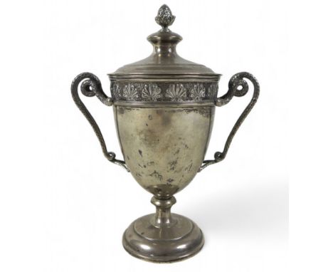 A George V silver lidded twin handle cup, Mappin and Webb Sheffield 1931/32, the lid having a pineapple knob with entwined se