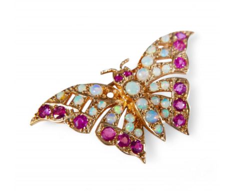 A 9ct gold opal and ruby stone butterfly brooch, 4.1 by 2.3cm, 4.9g.Condition: Missing one small opal from a wing