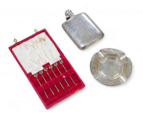 A group of silver, comprising a cased set of six cocktail sticks with enamelled cockerel terminals, a silver hip flask and as