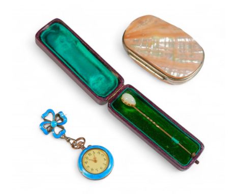 A yellow metal and opal stick pin, the tear drop shaped opal, 7 by 12 by 3mm, pin 7.3cm long, with coffin case, together with