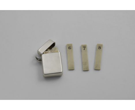 AN EDWARDIAN SMALL RECTANGULAR BUTT MARKER with a suspensory ring, hinged cover and gilt interior containing eight numbered i