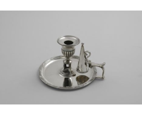 A GEORGE III CIRCULAR CHAMBER STICK with reed and ribbon border, conical snuffer and detachable nozzle by William Stroud, Lon