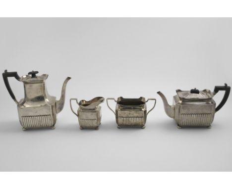 A LATE VICTORIAN FOUR-PIECE TEA &amp; COFFEE SERVICE with part-fluted rectangular bodies, button feet and angular handles, pr