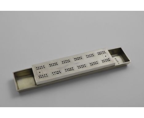 A LATE VICTORIAN CRIBBAGE BOARD in the form of a punk, with a gilt interior, by Alfred Fridlander, London 1890;  8"  (20.3 cm