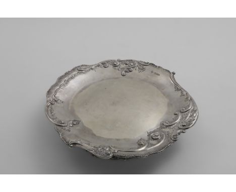 A LATE VICTORIAN DESSERT STAND OR TAZZA with embossed decoration around the rim and foot, and a registered design no., by R. 
