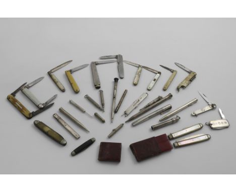 A MIXED LOT:- A George III mother of pearl mounted folding fruit knife and matching fruit fork in a fitted, red leather vase,
