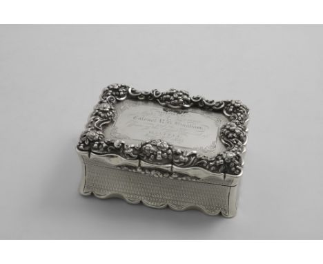 REGIMENTAL INTEREST:- A large Victorian snuff box  of shaped rectangular outline with concaved sides and engine-turned decora