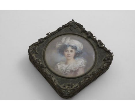 A LATE 19TH CENTURY FRENCH DECORATIVE, GILT-BRASS BOX square with rounded corners and applied floral borders, the cover inset