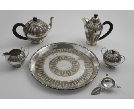 A MIDDLE EASTERN TEA &amp; COFFEE SERVICE TO INCLUDE:- A tea pot, coffee pot, sugar bowl &amp; cover, milk jug, tea strainer 