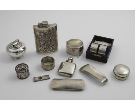 A MIXED LOT:- A shoe horn, a small plain spirit flask, two napkin rings, a bracelet, a mounted powder compact, a case for a p