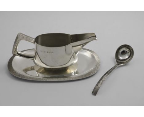 BY CHRISTOPHER N. LAWRENCE:- A late 20th century sauce boat and stand with matching ladle, with bark-textured border decorati