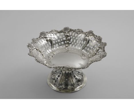 A LATE VICTORIAN PIERCED FRUIT DISH on a pedestal foot with applied flower borders by W. Gibson &amp; J. Langman, London 1888