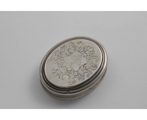 A QUEEN ANNE OVAL TOBACCO BOX with plain moulded borders, engraved on the cover with a large scrollwork cartouche with a shel