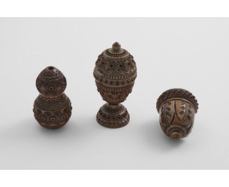 A LATE 18TH / EARLY 19TH CENTURY CARVED COQUILLA NUT NUTMEG GRATER in the form of an acorn, a carved coquilla nut money box, 