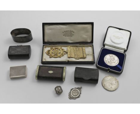 A MIXED LOT:- A silvergilt fraternity jewel, cased, a cased medal with the portrait of Edward the Confessor, a napkin ring, i