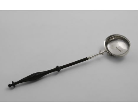 A GEORGE III / IV SCOTTISH PROVINCIAL PUNCH LADLE with a turned hardwood handle and an oval bowl with a bifurcated scroll jun
