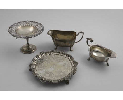 A VICTORIAN WAITER with a shell and scroll border and engraving, initialled in the centre, by H. Wilkinson &amp; Co., Sheffie