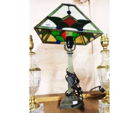 A modern Tiffany style table lamp with faceted shade