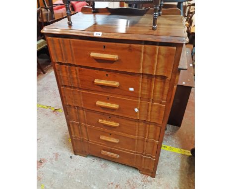 A 76cm 20th Century walnut and mixed wood chest with flight of six shape fronted long drawers, set on bracket feet