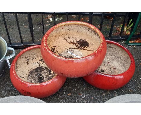 Three large ceramic red glazed garden planters