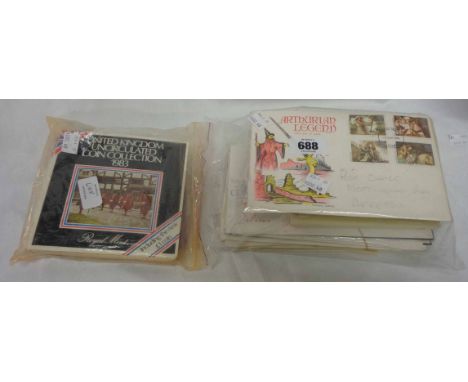 Two 1982 and two 1983 uncirculated coin sets, a quantity of First Day Covers and PHQ cards
