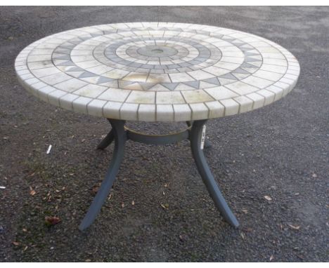 A 1.22m diameter heavy cast resin tile effect topped garden table