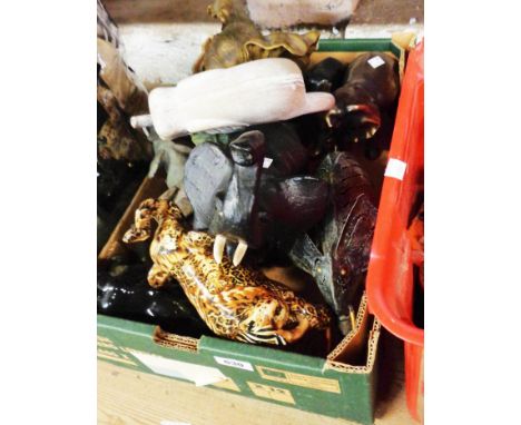 A box of assorted elephant figurines including resin, metal, and ceramic